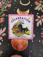 Load image into Gallery viewer, &quot;Broom Ride&quot; Glow-In-The-Dark Celebration Collection Honey and Hambo Enamel Pin by Scribble Creatures
